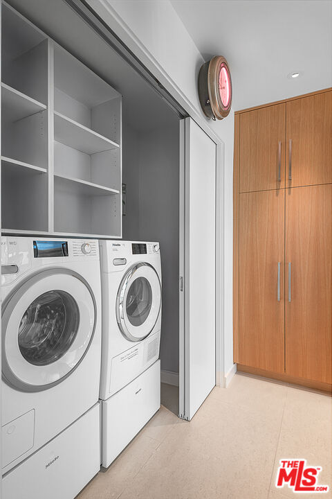 31201 Bailard Road Malibu, CA 90265 - Photo 38 of 56 a utility room with dryer and washer