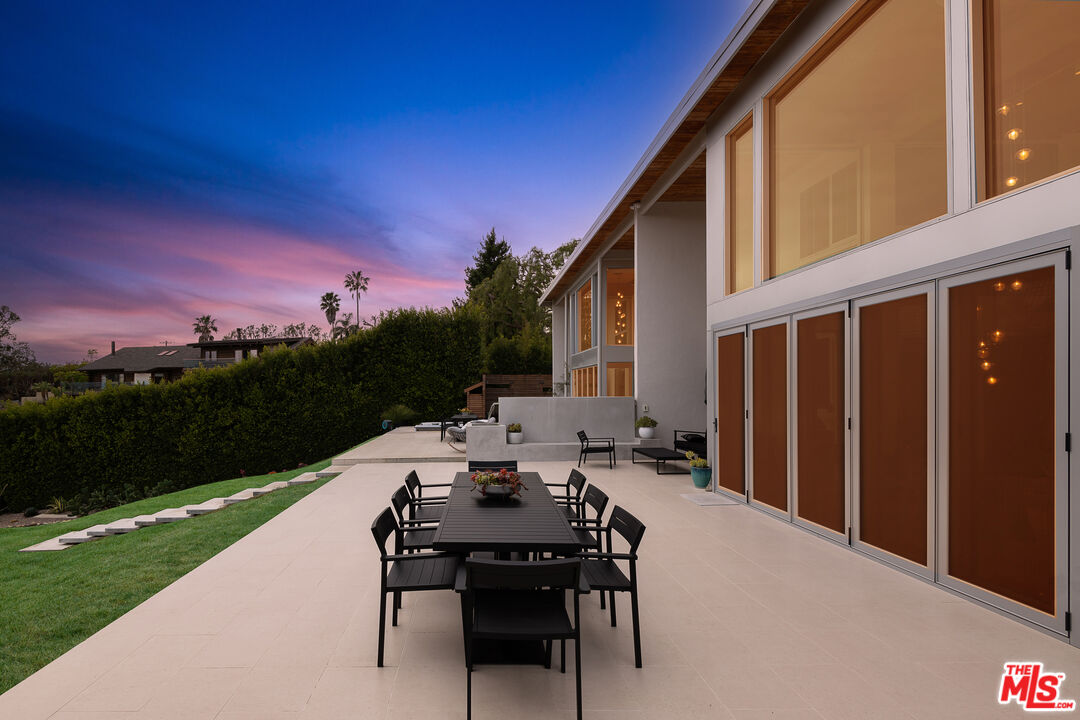 31201 Bailard Road Malibu, CA 90265 - Photo 52 of 56 a view of a patio with a table and chairs