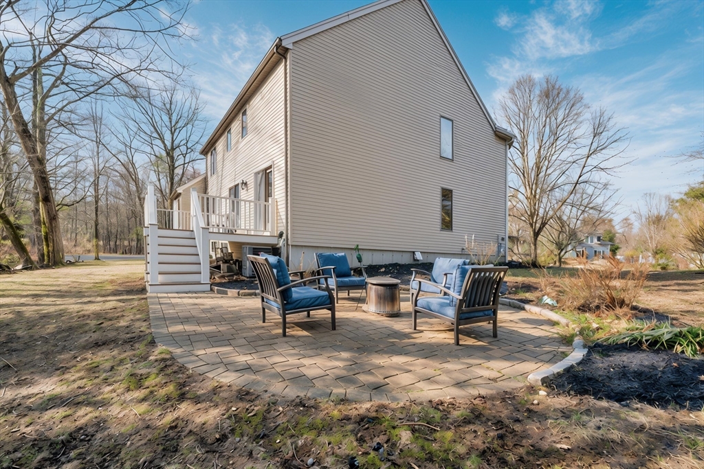 315 Candlestick Road North Andover, MA 01845 - Photo 41 of 42 a view of a patio with a yard