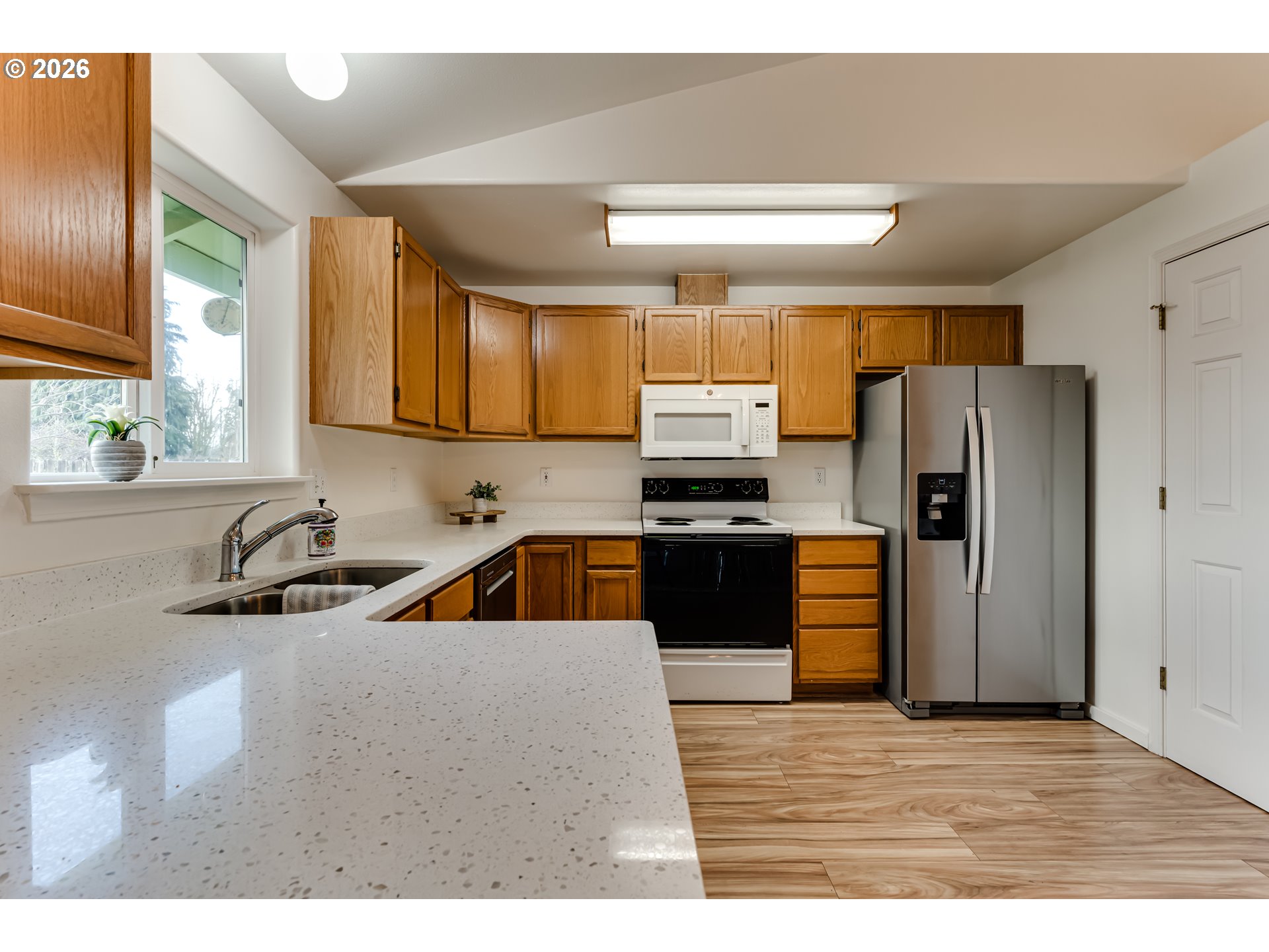 3497 Douglas Drive Springfield, OR 97478 - Photo 12 of 38 a kitchen with stainless steel appliances a sink a stove a refrigerator a counter top space and cabinets