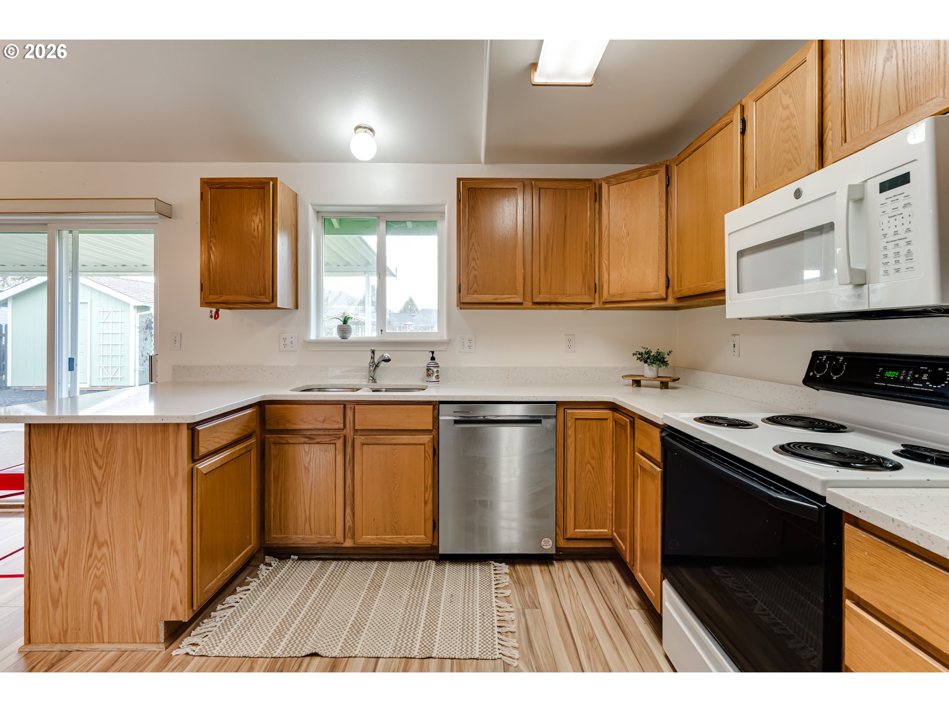 3497 Douglas Drive Springfield, OR 97478 - Photo 13 of 38 a kitchen with a sink stove and cabinets