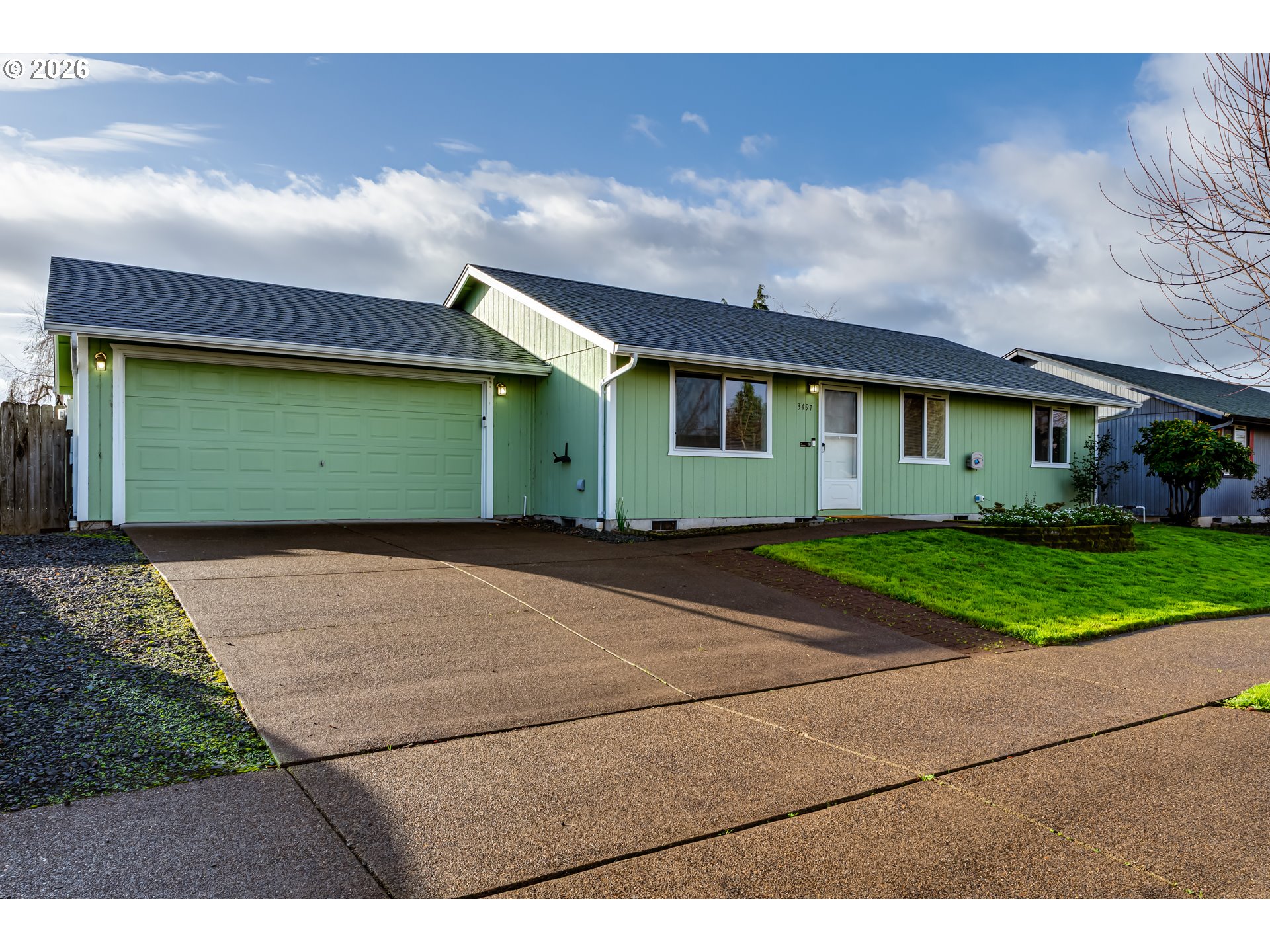 3497 Douglas Drive Springfield, OR 97478 - Photo 2 of 38 a front view of a house with a yard and garage