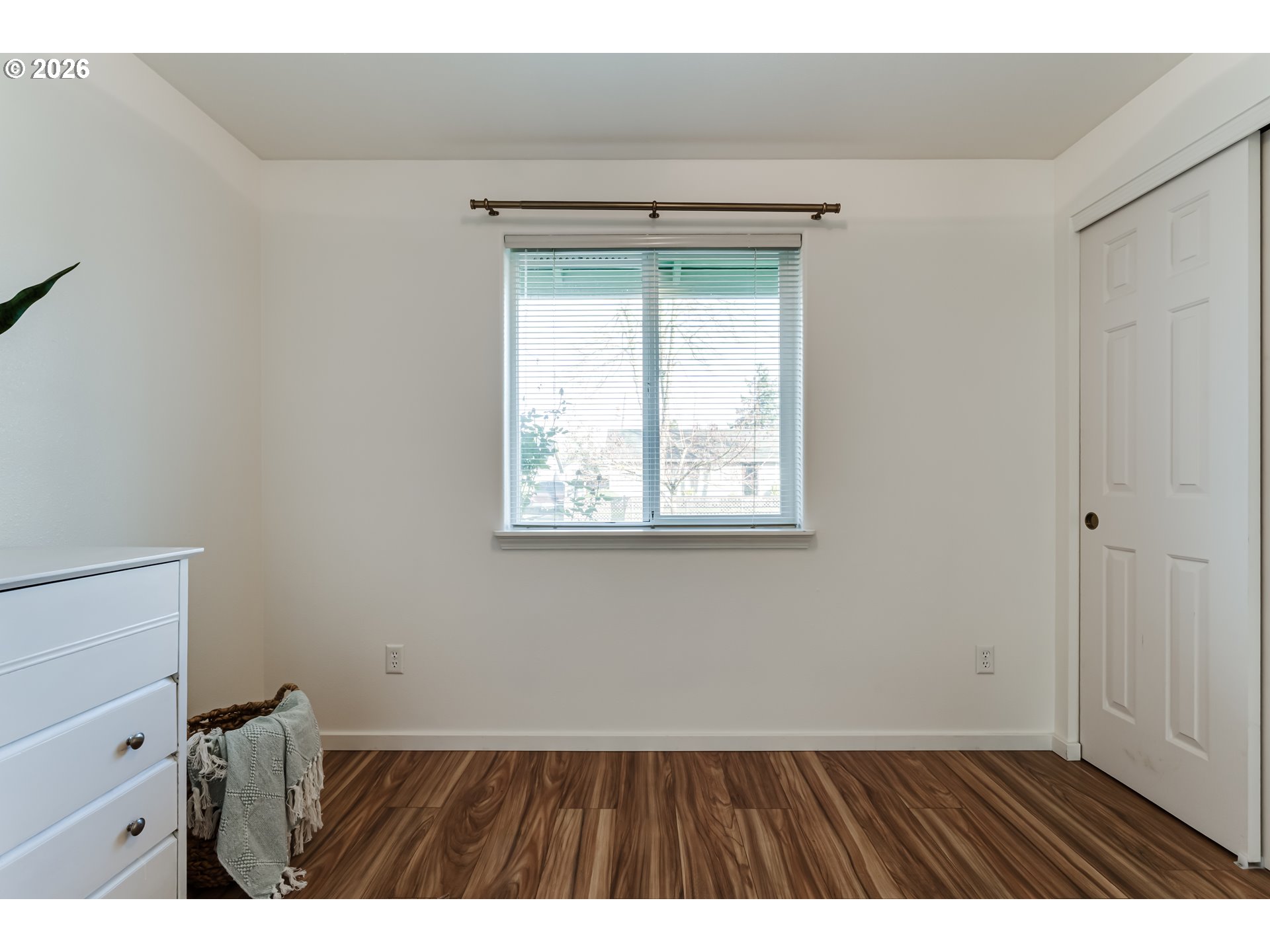 3497 Douglas Drive Springfield, OR 97478 - Photo 27 of 38 a view of an empty room with a window and wooden floor