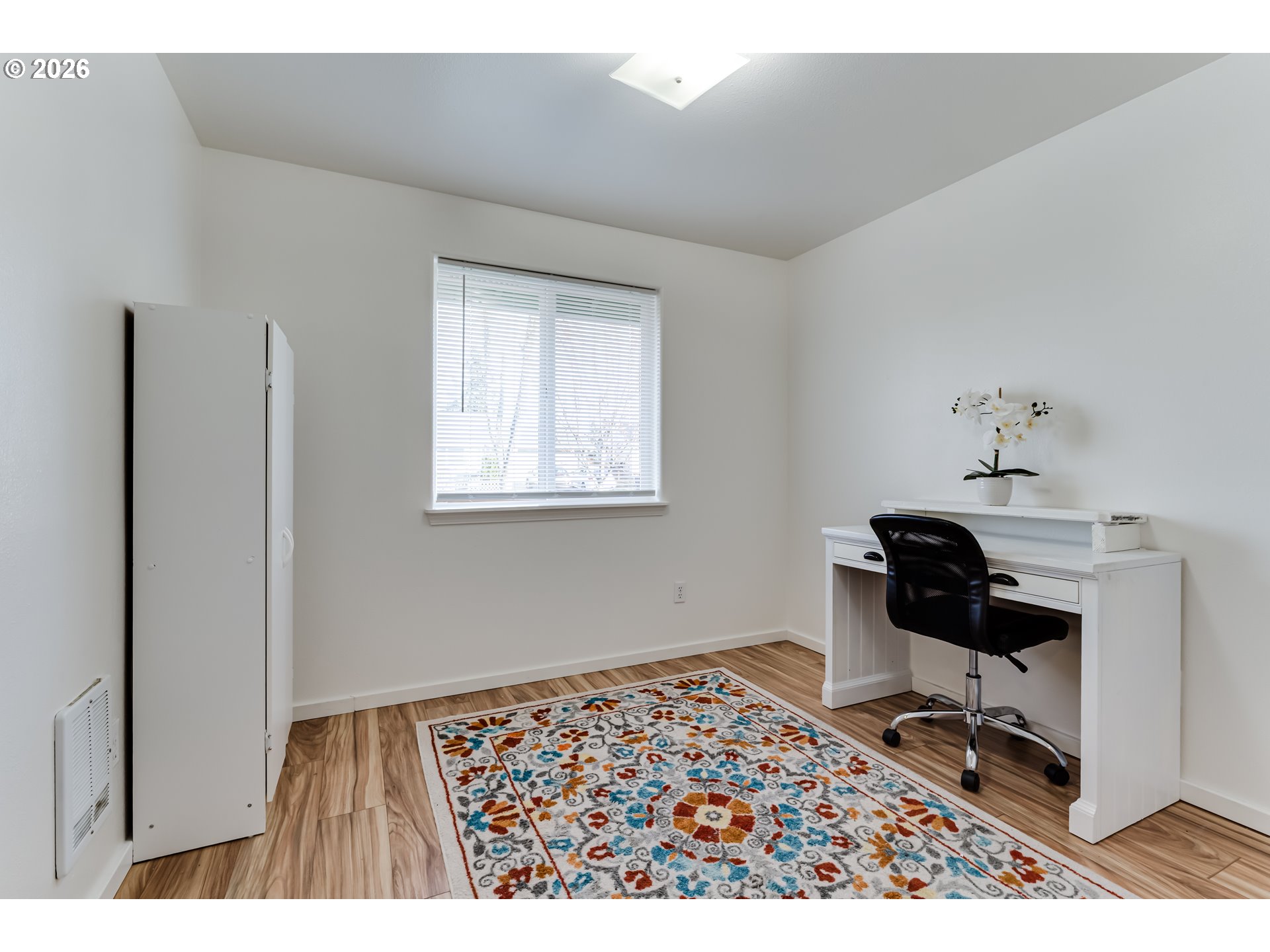 3497 Douglas Drive Springfield, OR 97478 - Photo 29 of 38 a bedroom with a bed and wooden floor