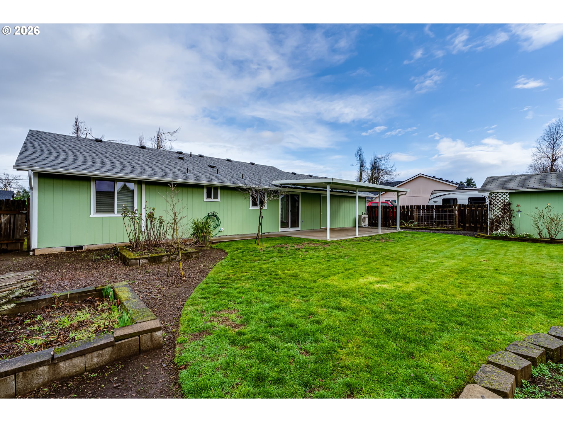 3497 Douglas Drive Springfield, OR 97478 - Photo 32 of 38 a view of a house with a backyard and a garden
