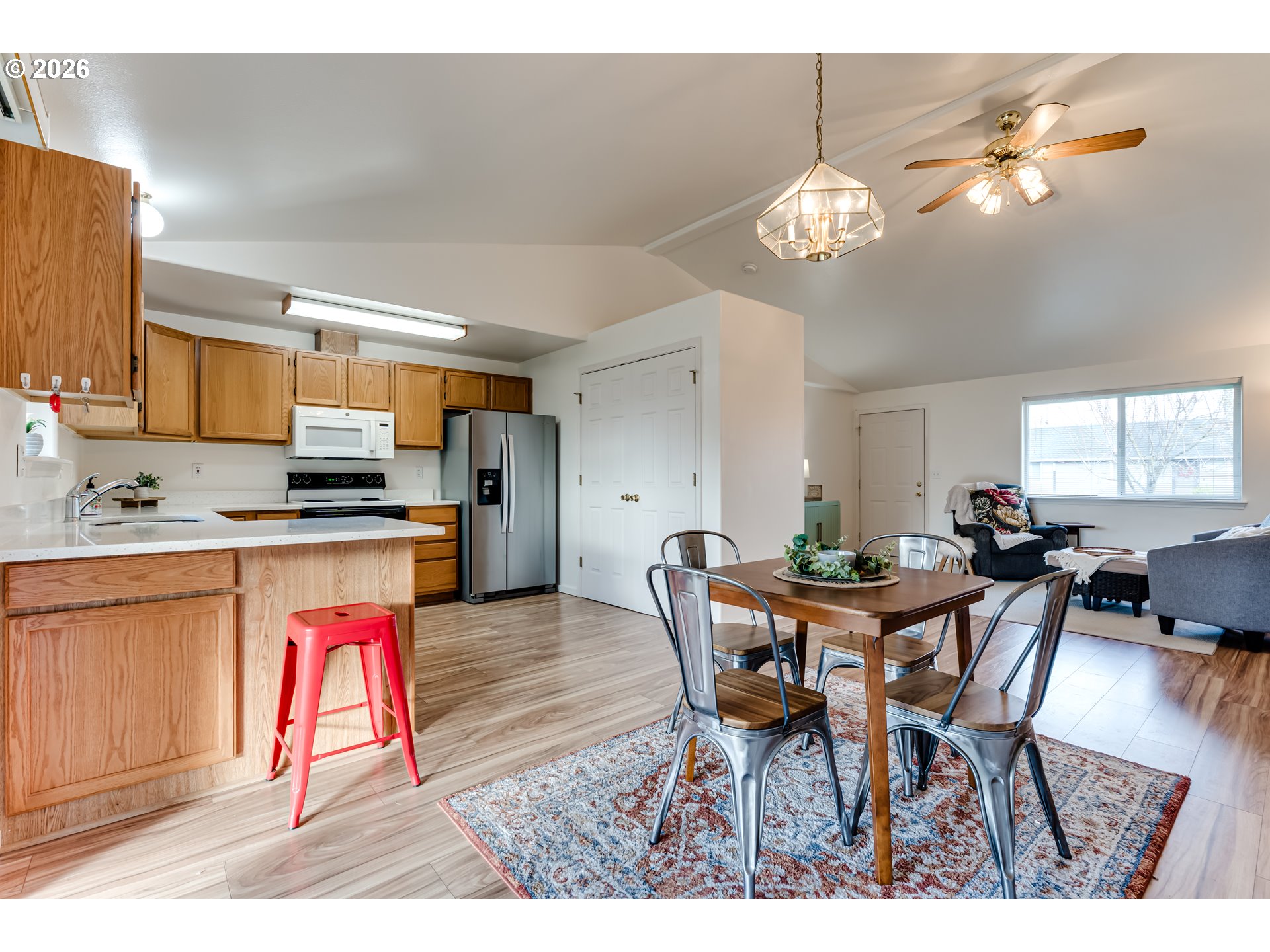 3497 Douglas Drive Springfield, OR 97478 - Photo 7 of 38 a view of a dining room with furniture and a chandelier