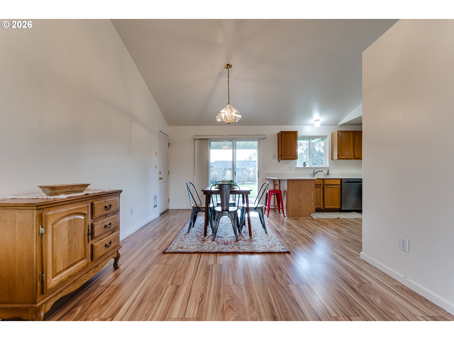 3497 Douglas Drive Springfield, OR 97478 - Photo 10 of 38 a view of a dining room with furniture window and wooden floor