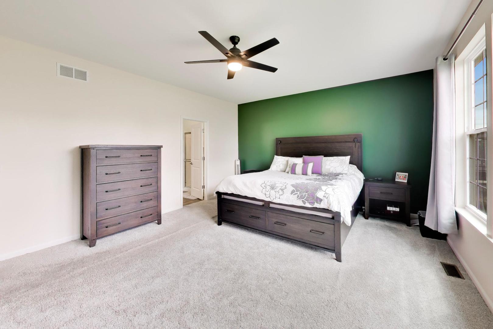 14831 Whitney Street Manhattan, IL 60442 - Photo 15 of 37 a living room with furniture and a ceiling fan