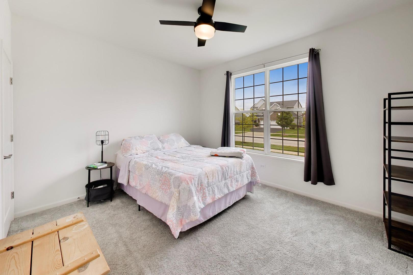 14831 Whitney Street Manhattan, IL 60442 - Photo 23 of 37 a bedroom with a bed closet and window