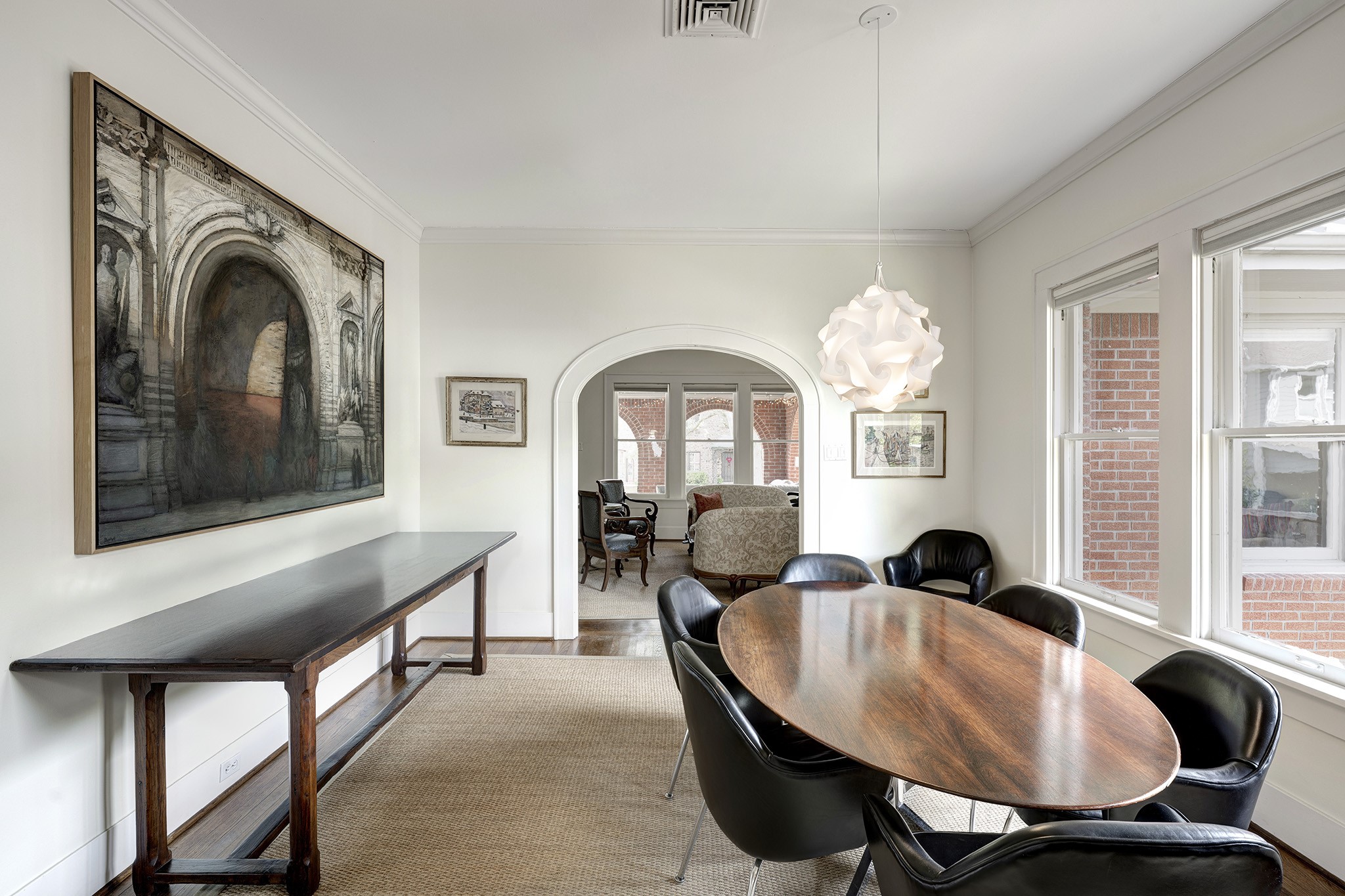 1902 Bolsover Street Houston, TX 77005 - Photo 5 of 27 Wood floors and a modern light fixture highlight the dining room.