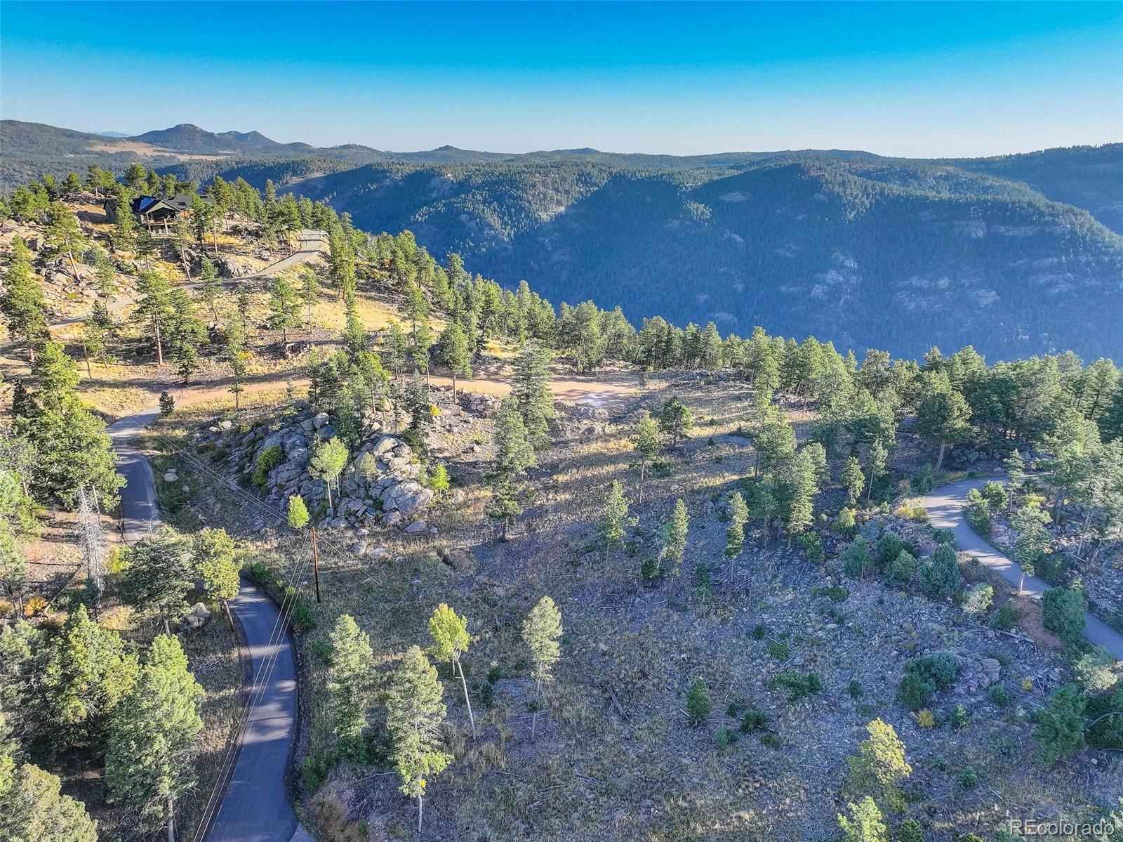 23047 Big Game Trail Conifer, CO 80433 - Photo 17 of 41 a view of a city with mountains in the background