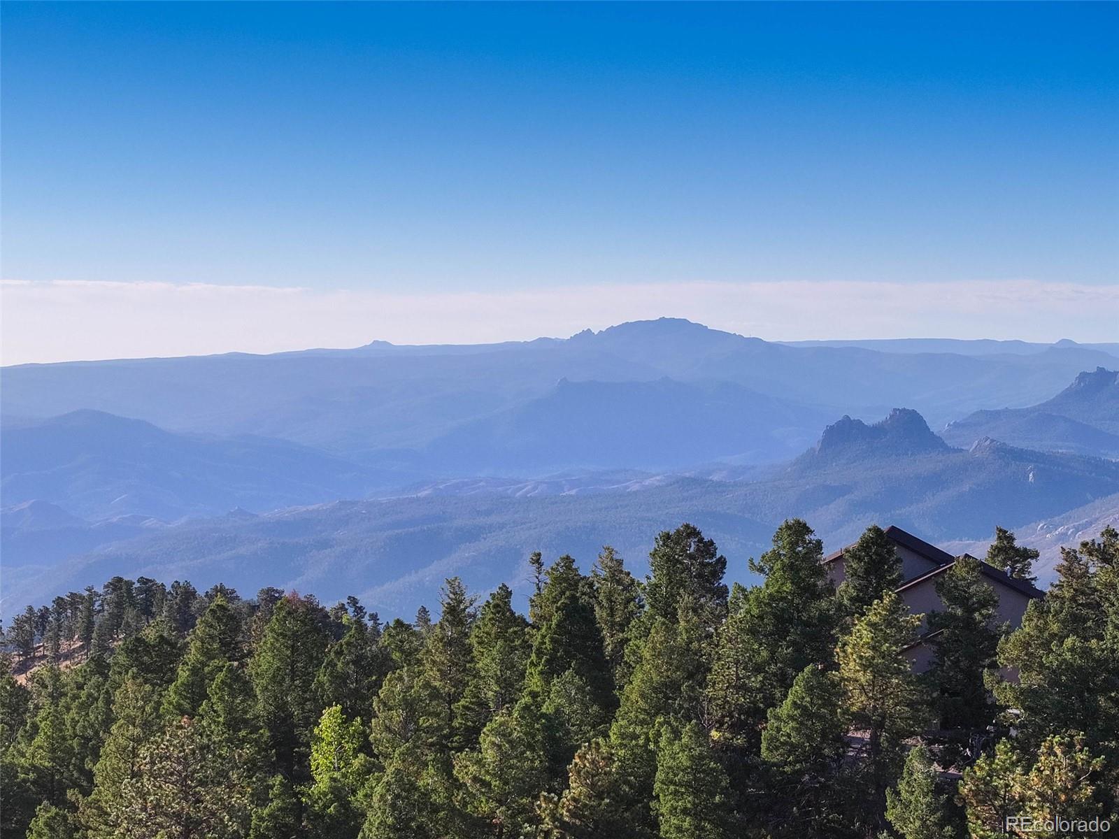 23047 Big Game Trail Conifer, CO 80433 - Photo 31 of 41 an aerial view of mountain with tree in the background