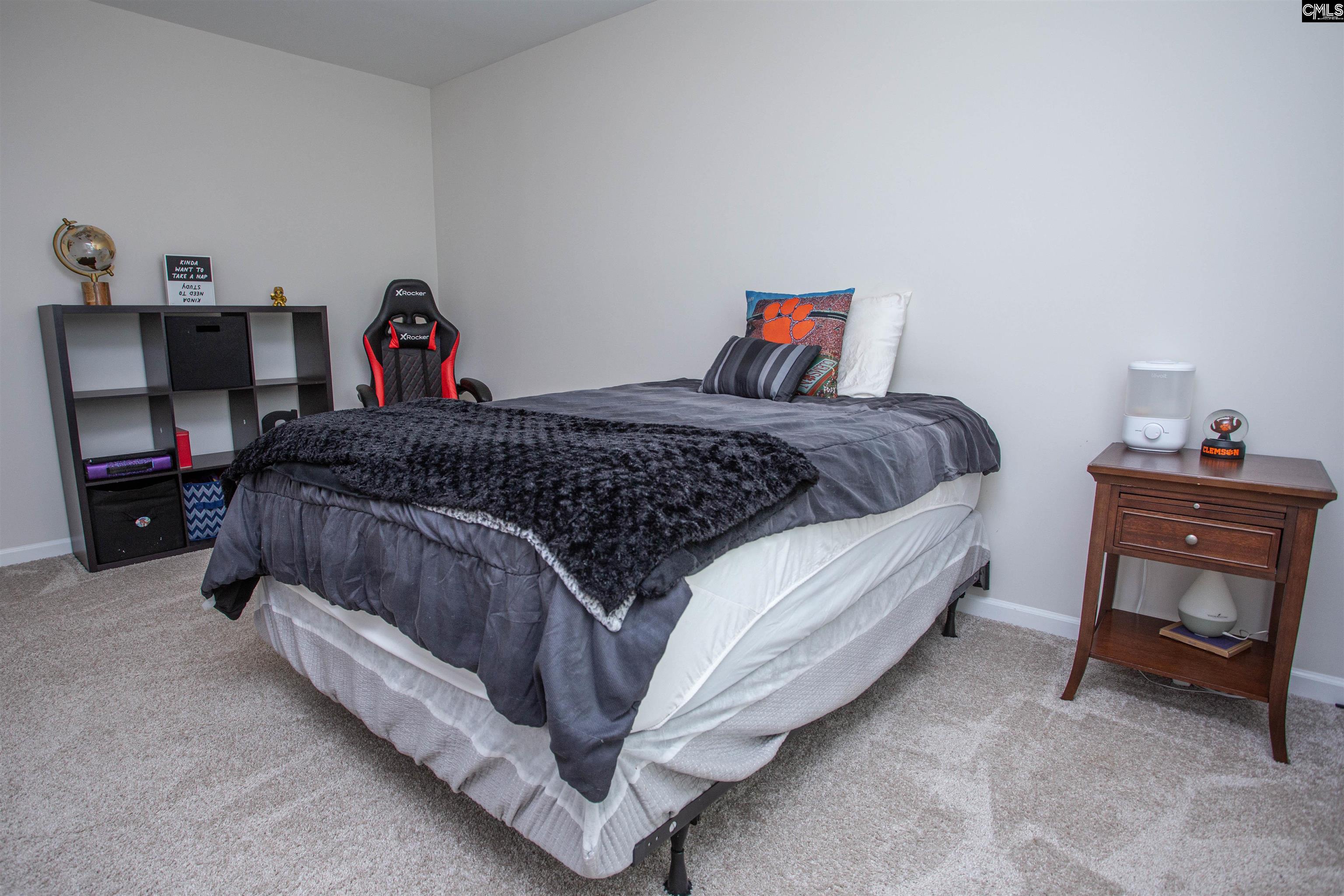 272 Shadowbrook Way Camden, SC 29020 - Photo 31 of 43 a bedroom with a bed and a tv