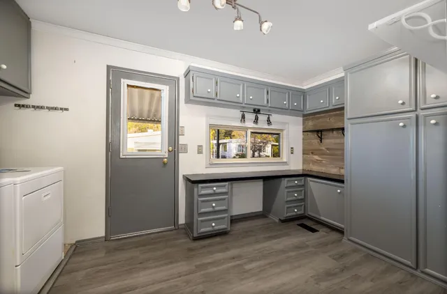 a room with window and cabinets