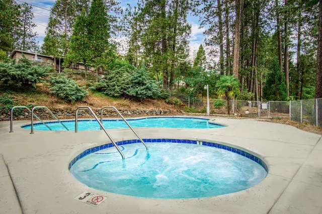 a view of swimming pool with a patio