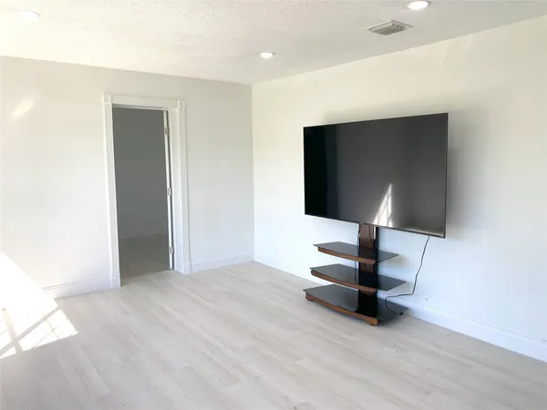 a view of a livingroom with a flat screen tv