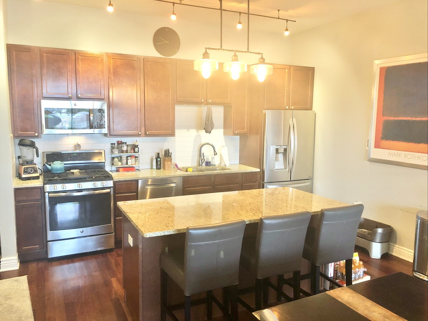 3300 West Irving Park Road, Unit H5 Chicago, IL 60618 - Photo 11 of 21 a large kitchen with kitchen island a large window in it
