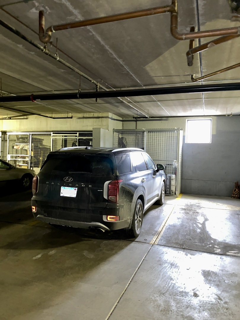 3300 West Irving Park Road, Unit H5 Chicago, IL 60618 - Photo 21 of 21 a car parked in a parking