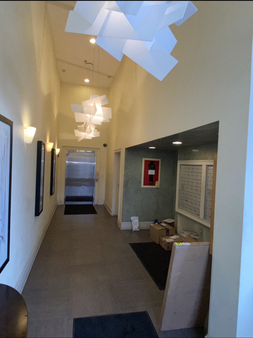 3300 West Irving Park Road, Unit H5 Chicago, IL 60618 - Photo 3 of 21 a view of hall way with furniture