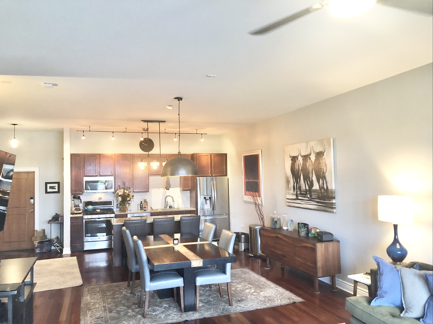 3300 West Irving Park Road, Unit H5 Chicago, IL 60618 - Photo 9 of 21 a room with lots of furniture and lamp