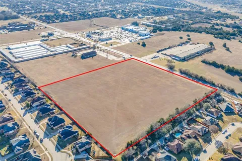 a view of a big yard with lots of green space