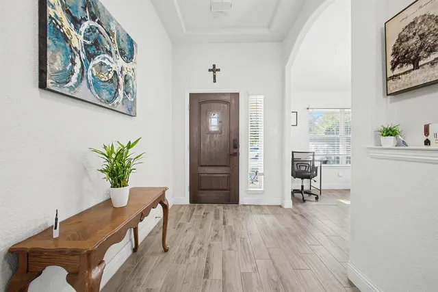 a workspace room with furniture and wooden floor