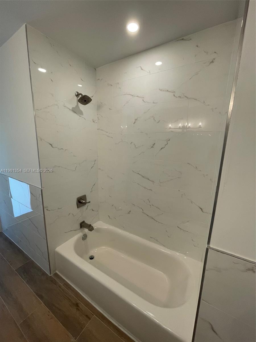 10343 Southwest 114th Street Miami, FL 33176 - Photo 12 of 25 a bathroom with a bathtub