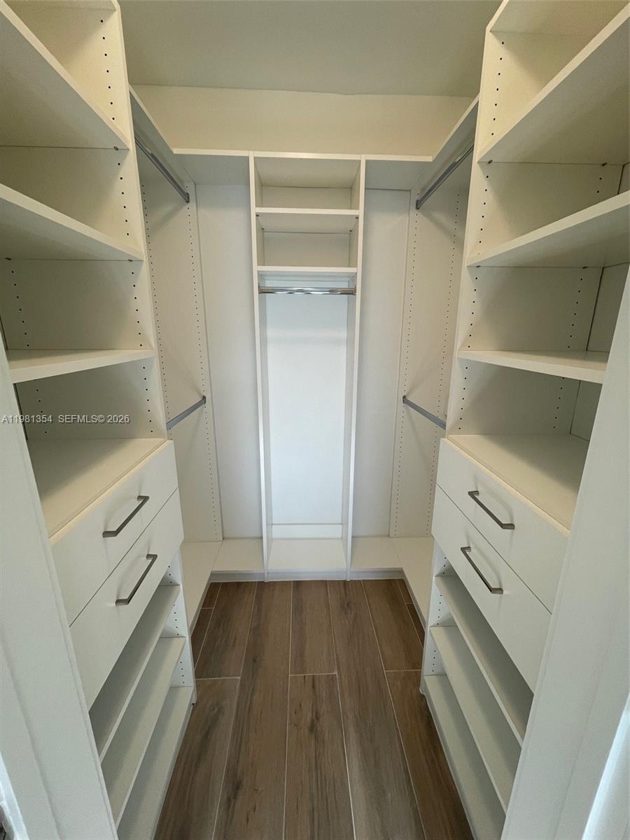 10343 Southwest 114th Street Miami, FL 33176 - Photo 17 of 25 a view of walk in closet with empty racks