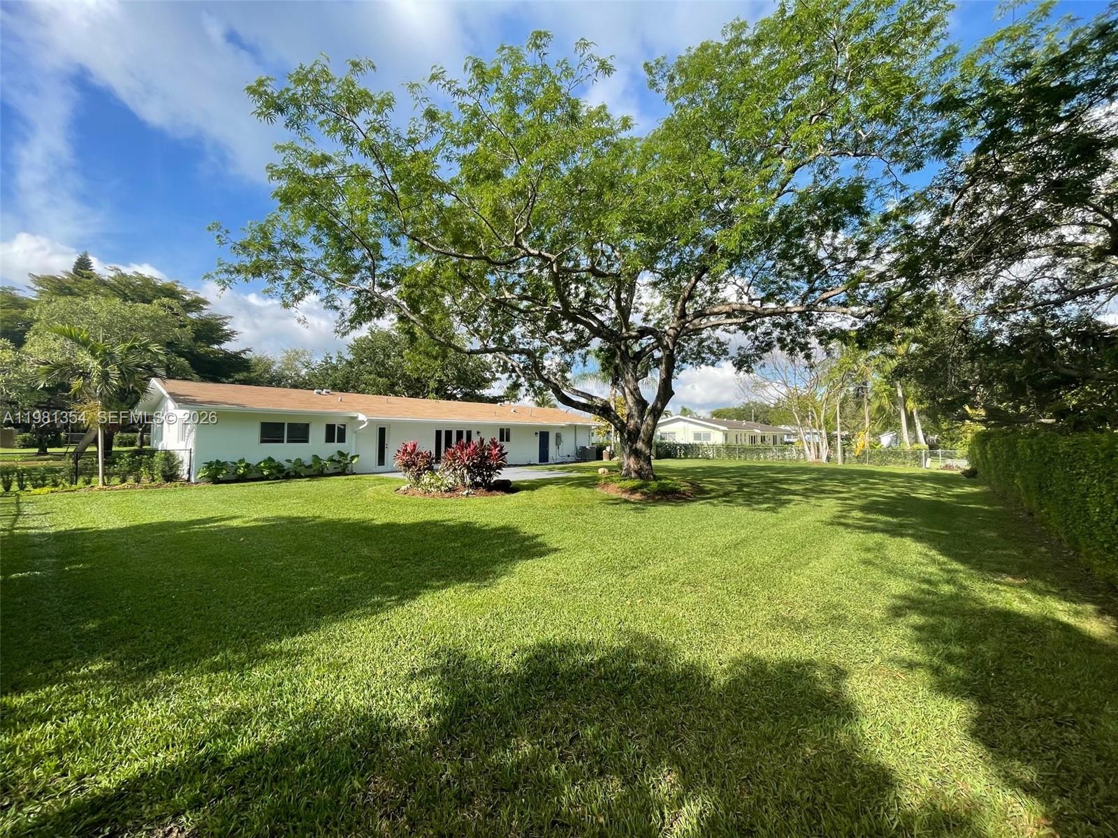 10343 Southwest 114th Street Miami, FL 33176 - Photo 22 of 25 a front view of a house with garden