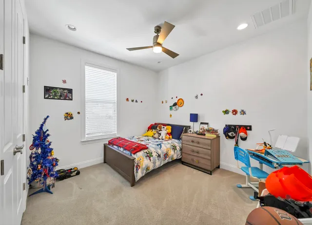 a bedroom with bed and closet