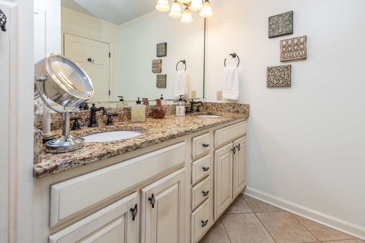 5390 Sea Isle Road Memphis, TN 38119 - Photo 25 of 35 a bathroom with a granite countertop double vanity sink and a mirror