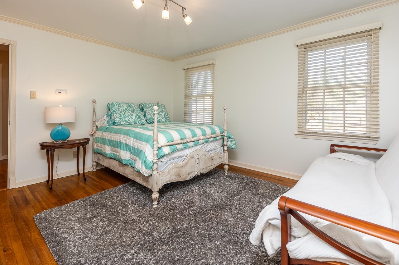 5390 Sea Isle Road Memphis, TN 38119 - Photo 28 of 35 a bedroom with a bed table and two windows