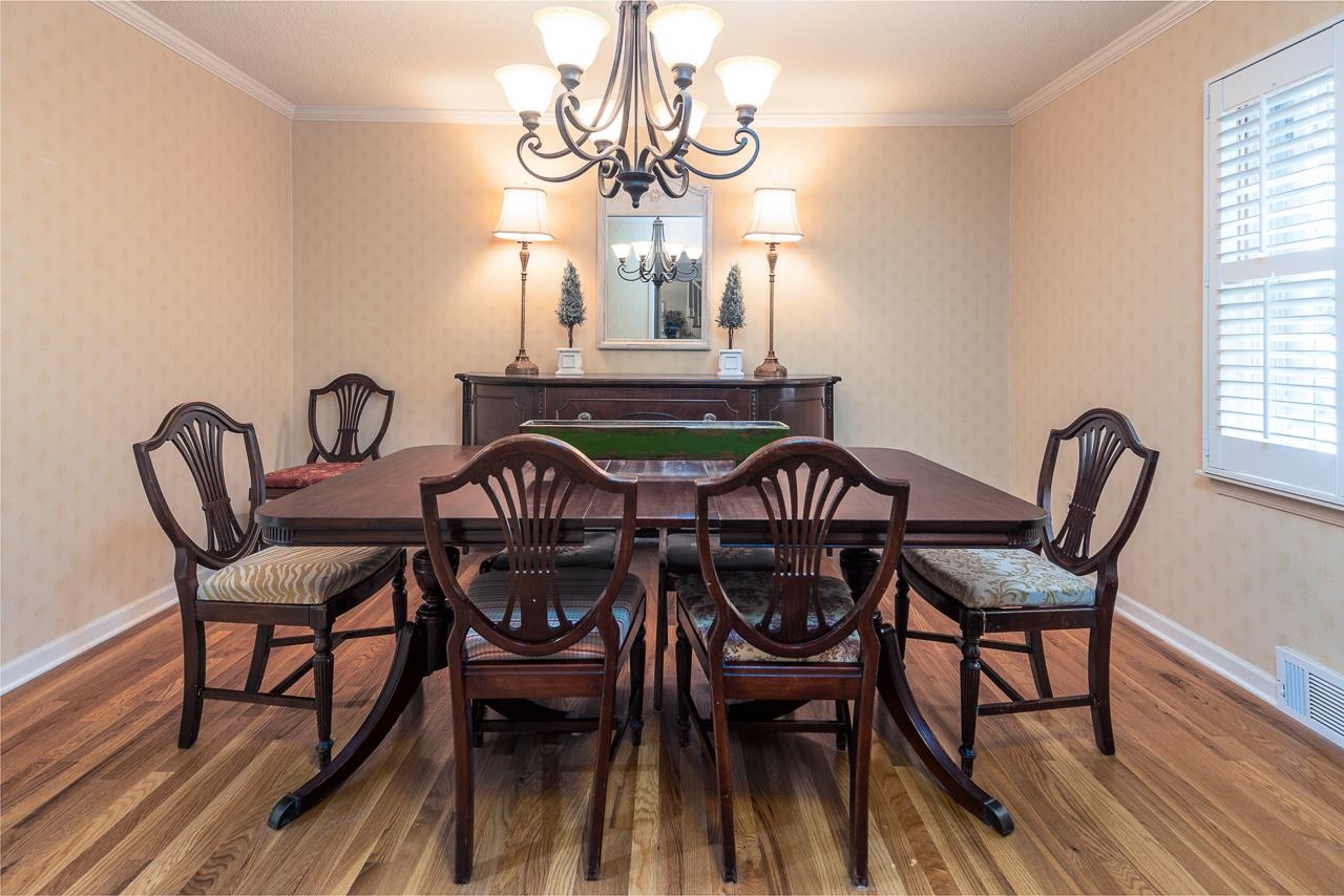 5390 Sea Isle Road Memphis, TN 38119 - Photo 7 of 35 a view of a dining room with furniture window and wooden floor