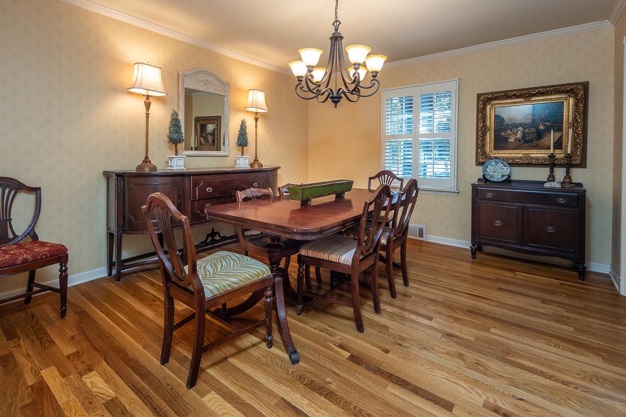 5390 Sea Isle Road Memphis, TN 38119 - Photo 8 of 35 a view of a dining room with furniture and wooden floor