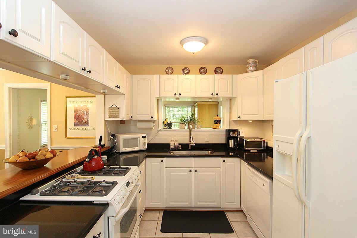 5923 Conway Road Bethesda, MD 20817 - Photo 11 of 26 Kitchen w/pass-thru to Office/PlayRm