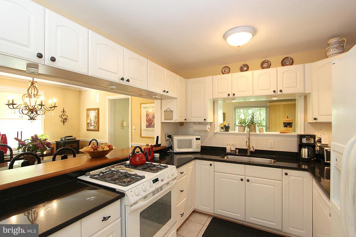 5923 Conway Road Bethesda, MD 20817 - Photo 12 of 26 Kitchen w/bar and abundant light!