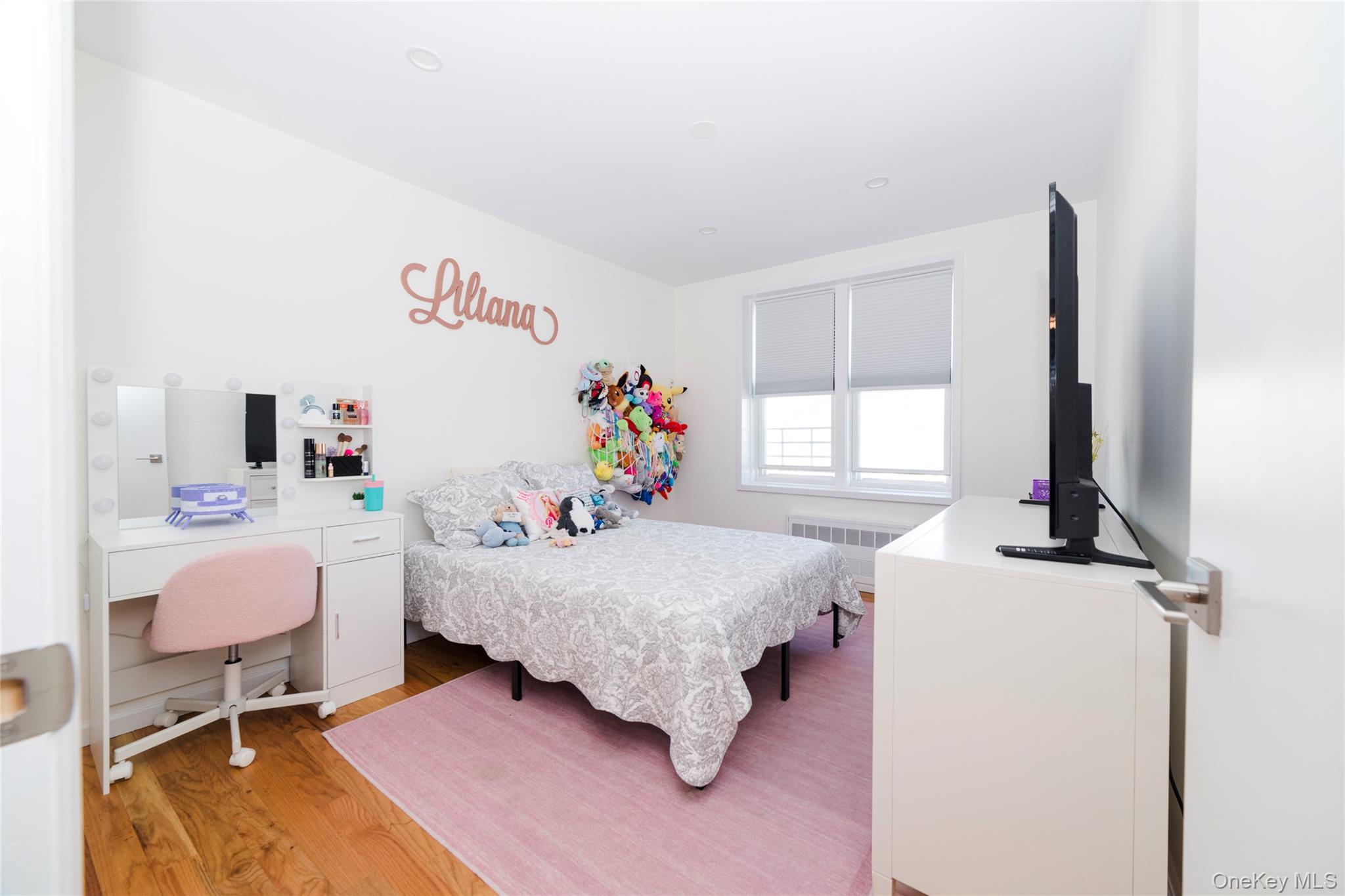 90 Union Street, Unit 5G New Rochelle, NY 10805 - Photo 12 of 18 a bed room with a bed and a desk