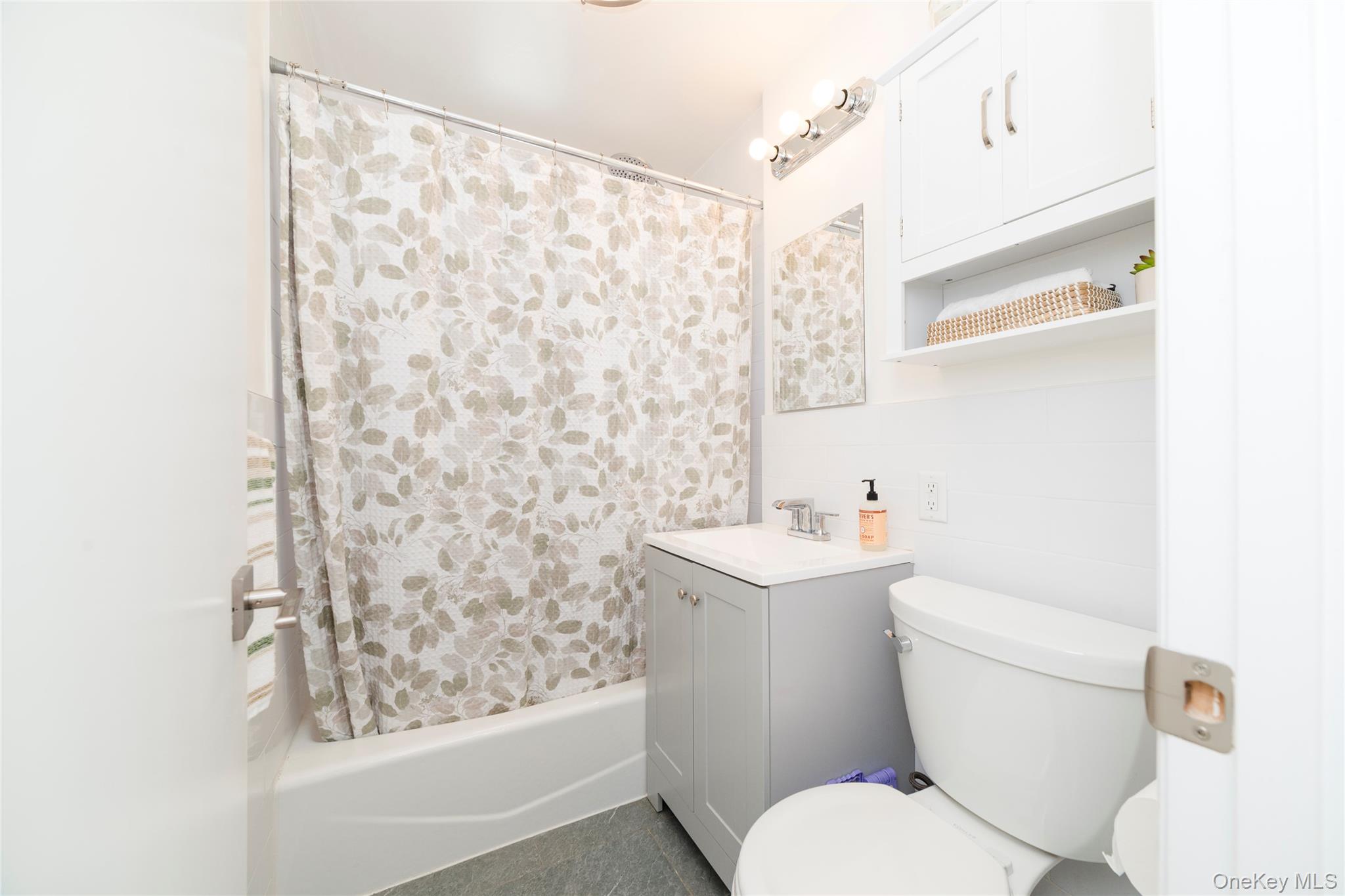 90 Union Street, Unit 5G New Rochelle, NY 10805 - Photo 13 of 18 a white toilet sitting next to a bathroom sink