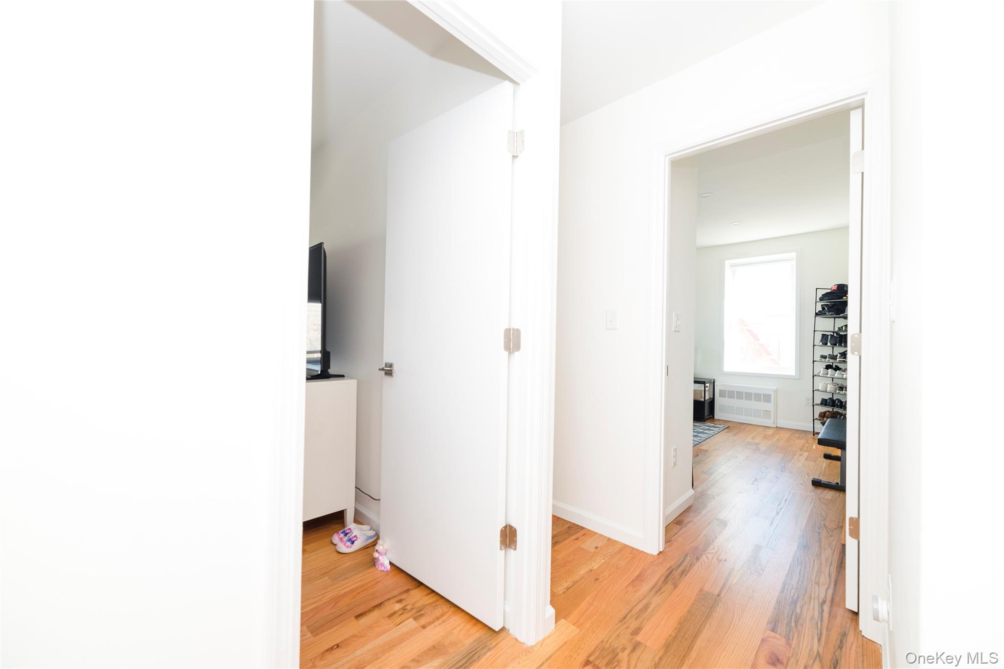 90 Union Street, Unit 5G New Rochelle, NY 10805 - Photo 14 of 18 a view of a hallway with wooden floor