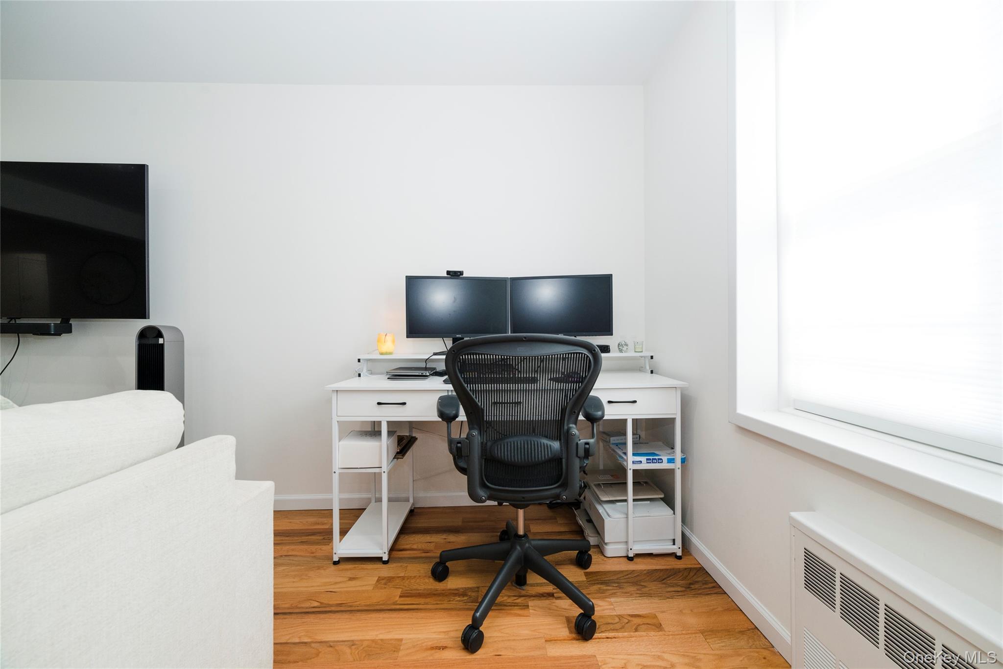 90 Union Street, Unit 5G New Rochelle, NY 10805 - Photo 15 of 18 a view of a workspace with furniture and a window