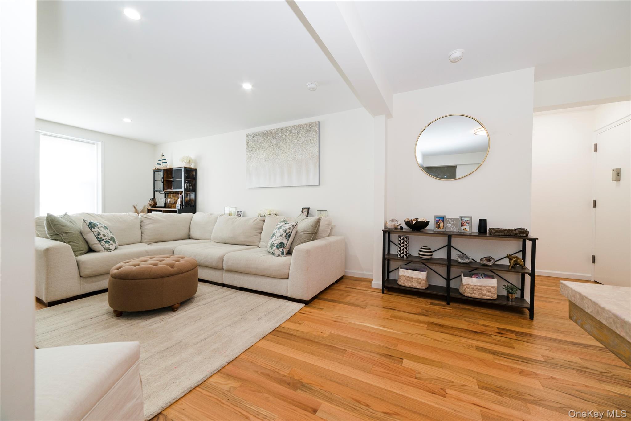 90 Union Street, Unit 5G New Rochelle, NY 10805 - Photo 5 of 18 a living room with furniture and a wooden floor