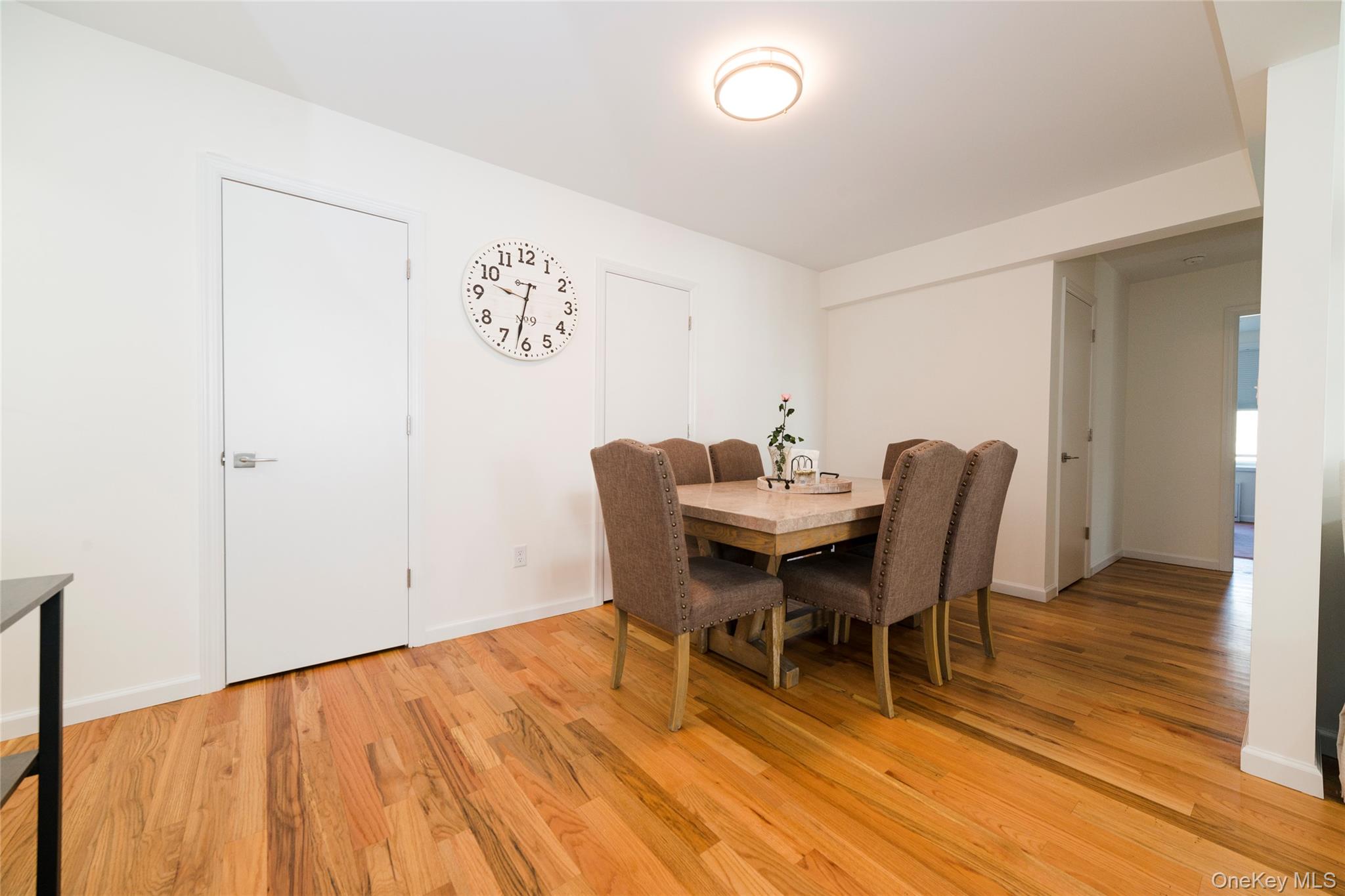 90 Union Street, Unit 5G New Rochelle, NY 10805 - Photo 9 of 18 a view of a dining room with furniture and wooden floor