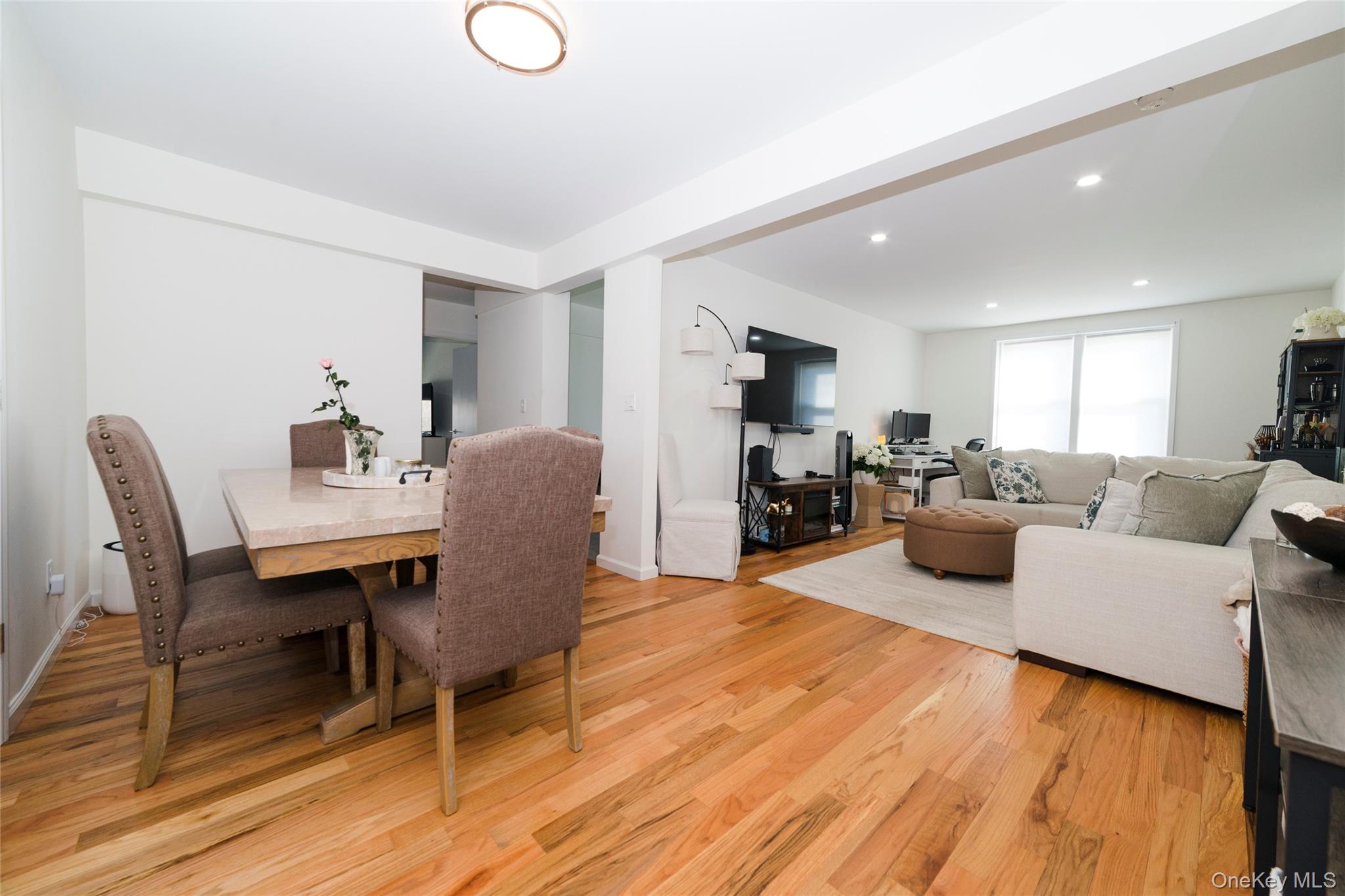 90 Union Street, Unit 5G New Rochelle, NY 10805 - Photo 10 of 18 a living room with furniture wooden floor and a dining table