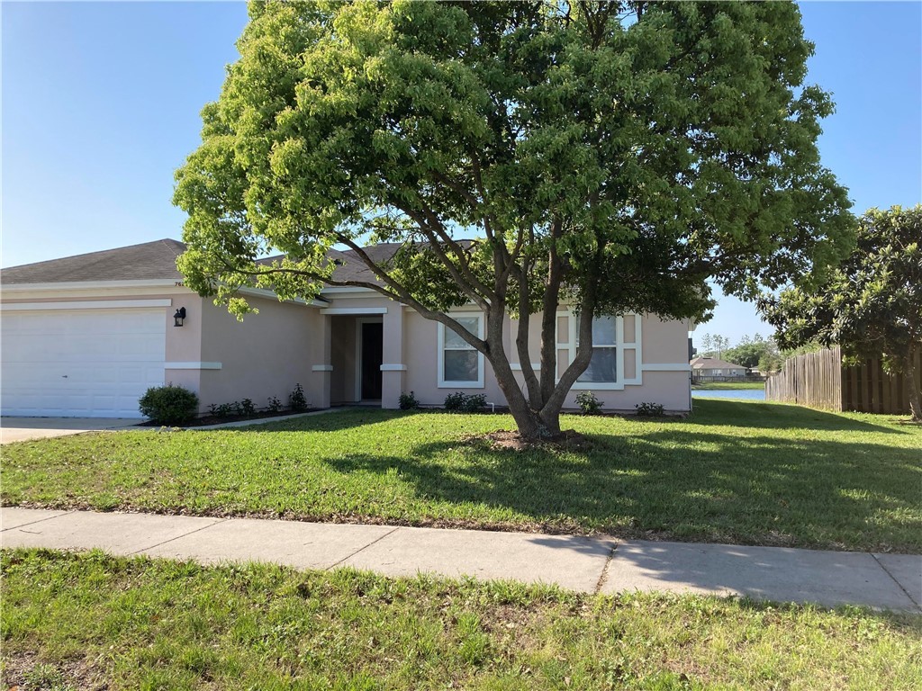 76222 Long Pond Loop Yulee, FL 32097 - Photo 1 of 6 a front view of a house with a yard