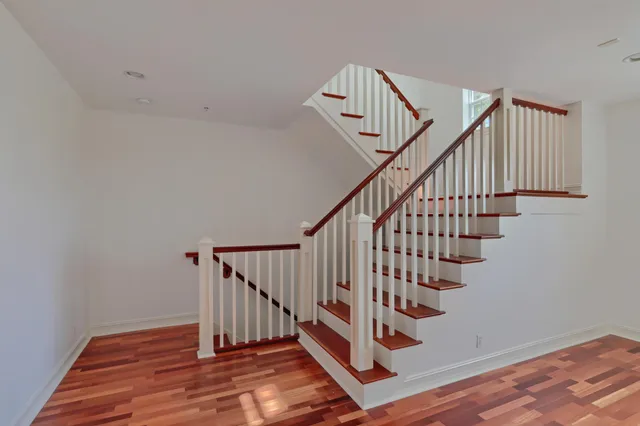 a view of entryway with wooden floor and stairs