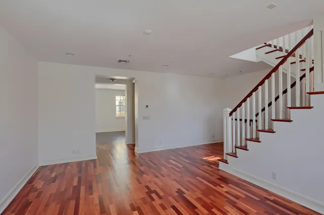 a view of an entryway with wooden floor