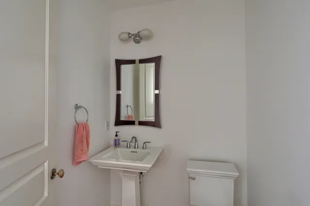 a kitchen with granite countertop wooden floors and sink