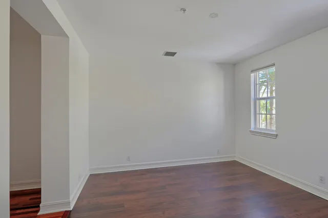 a view of hallway with wooden floor