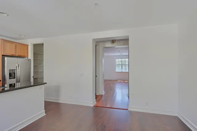 a kitchen with stainless steel appliances granite countertop a stove and a refrigerator
