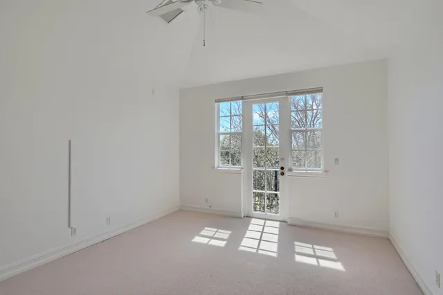 a bathroom with a granite countertop sink a mirror and a shower